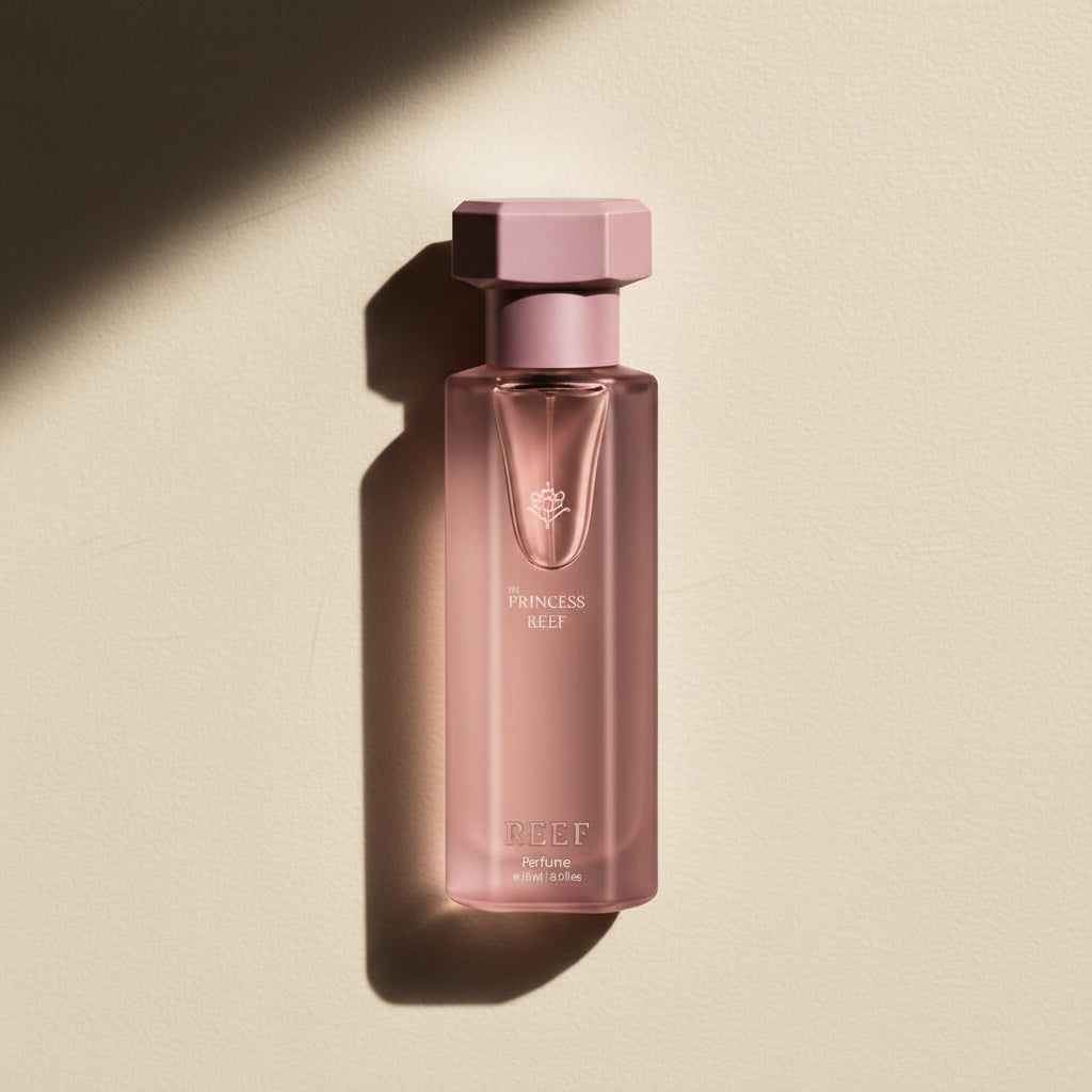 Pink perfume bottle on a white background